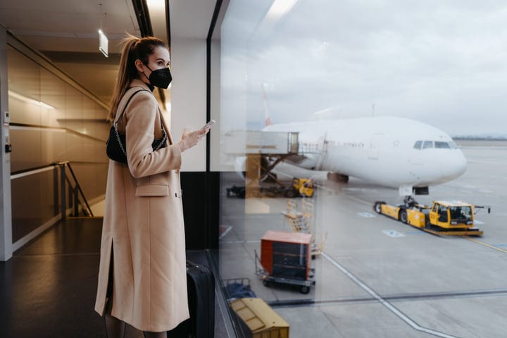 A Traveler Awaits Her Flight With Anticipation