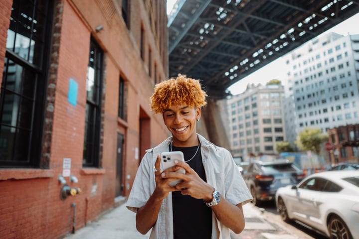 Young Urbanite Enjoying A Digital Moment In NYC