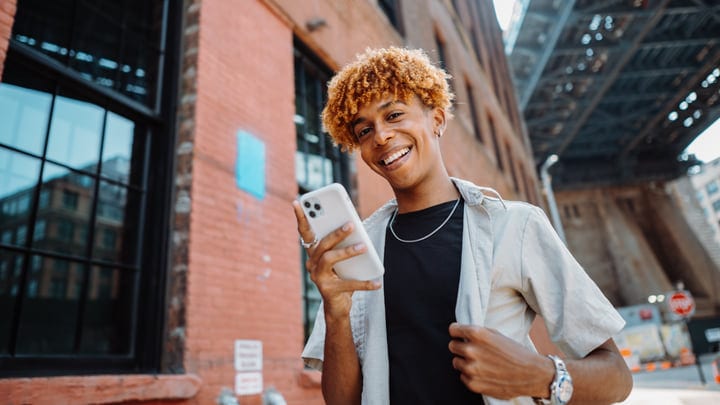 Youthful Joy Under Urban Bridges With Smartphone