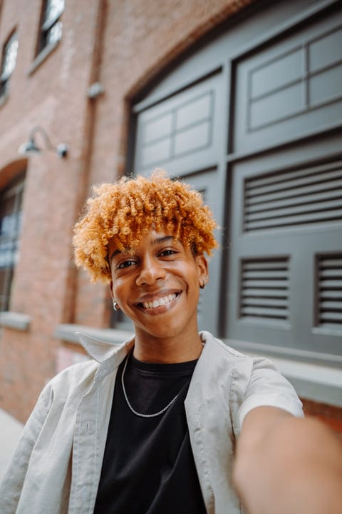 Joyful Youth Capturing a Selfie in Urban NYC