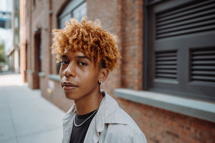 Bright Curls and Urban Vibes on a New York Street