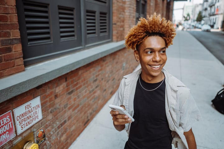 Young Person Embracing NYC's Vibrant Streets With Smile