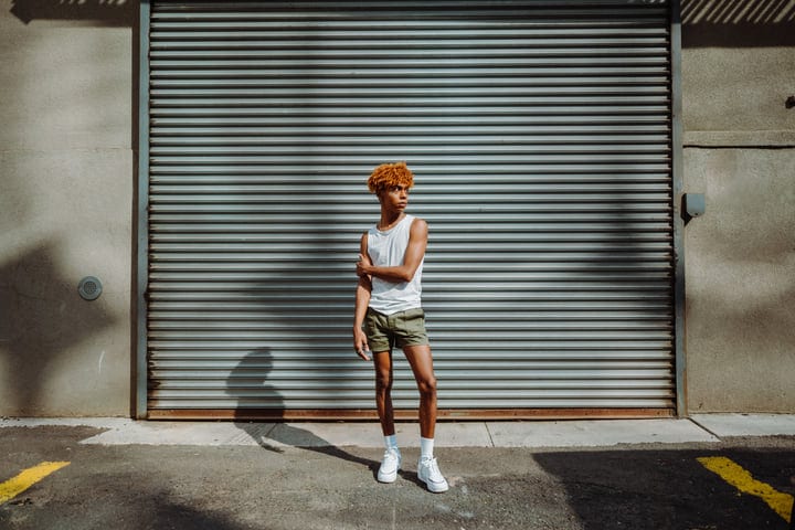 Youth Embraces Summer Style Against Urban Backdrop
