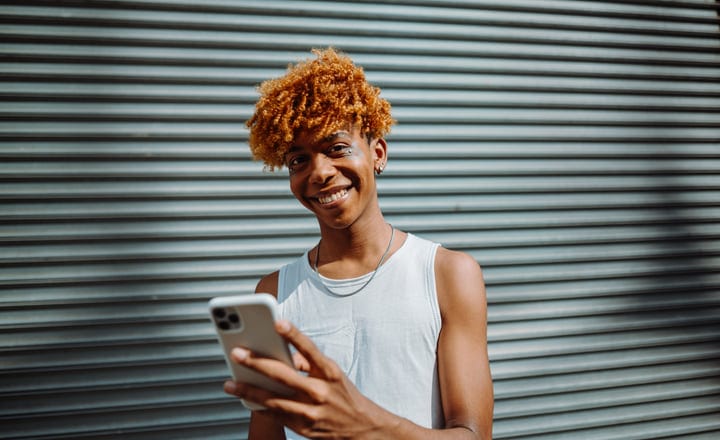 Bright Smile As Urban Youth Engages With Technology