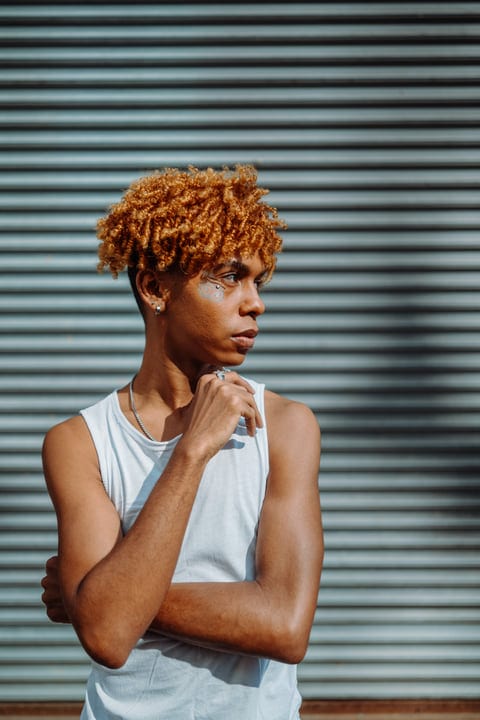 Contemplative Youth Ponders Future in Urban Setting