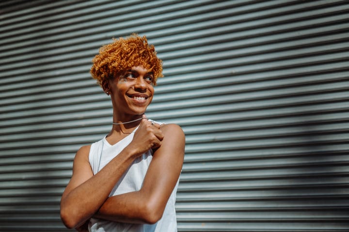 Confident Young Adult Against Urban Metal Background