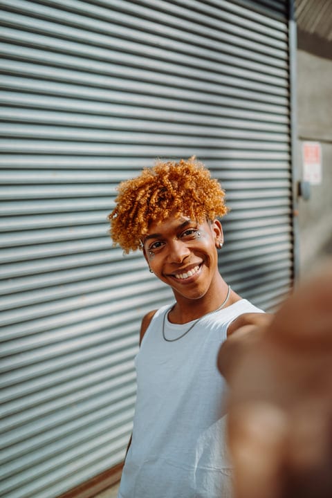 A Youthful Smile Captured Against Urban Backdrop In NYC