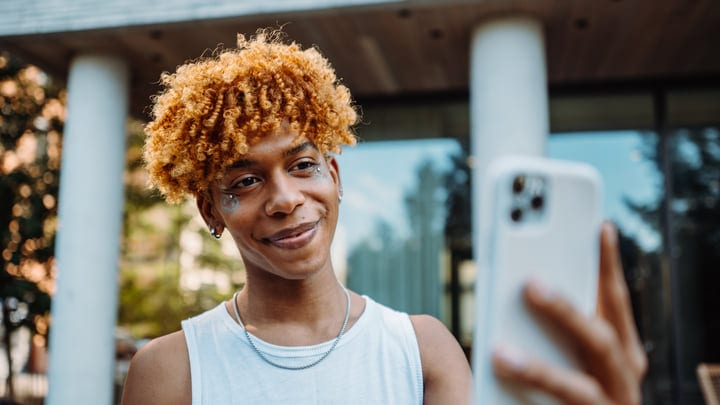Candid Moment Of Youth Capturing A Selfie In Urban NYC