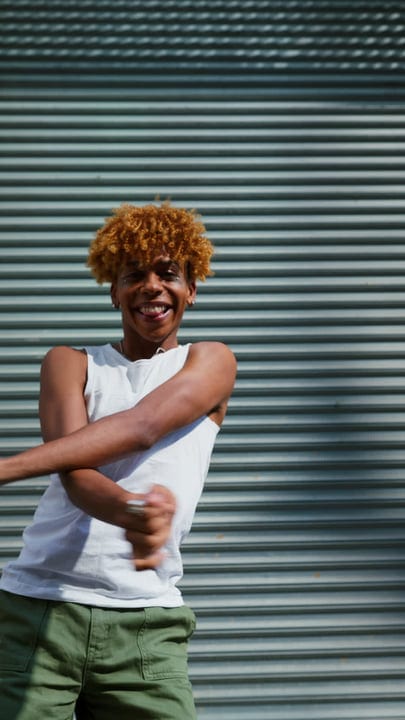 Energetic Youth Expressing Joy Against an Urban Backdrop
