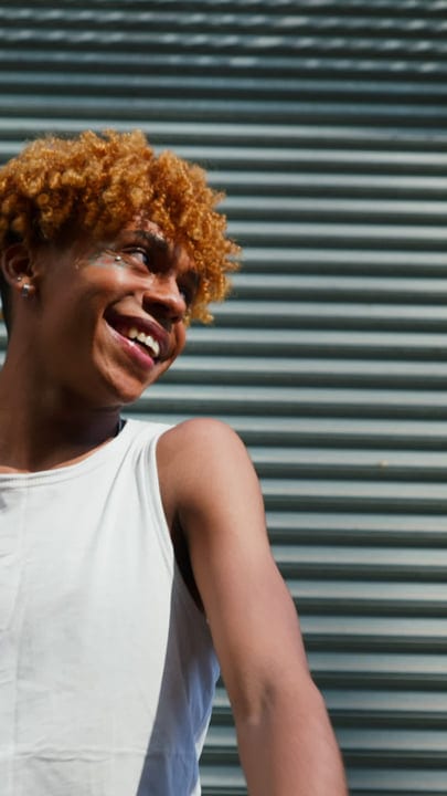 Joyful Expression Of Urban Youth Against Metal Shutters