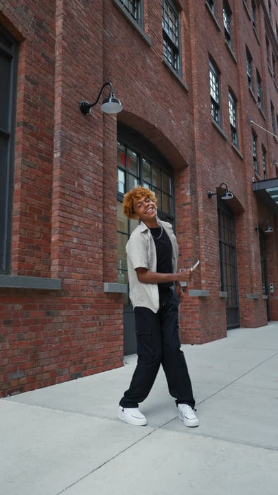 Joyful Youth Dancing on a Vibrant NYC Street