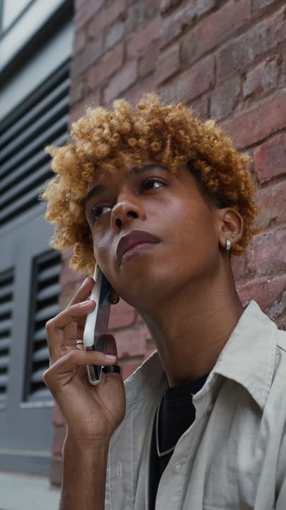 Young Urbanite Engaged In A Phone Call On The Street