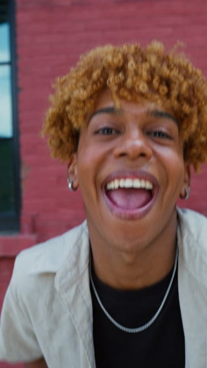 Joyful Laughter Echoes Against a Vibrant Brick Wall