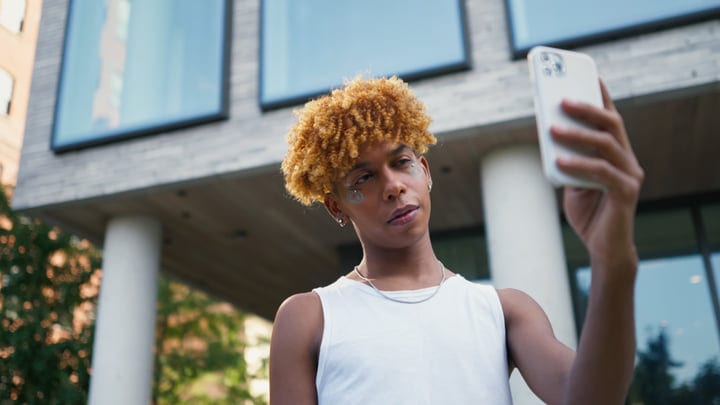 Youthful Self-Expression Captured On A Vibrant City Street
