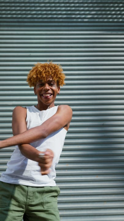 Joyful Dance Moves Against Urban Backdrop