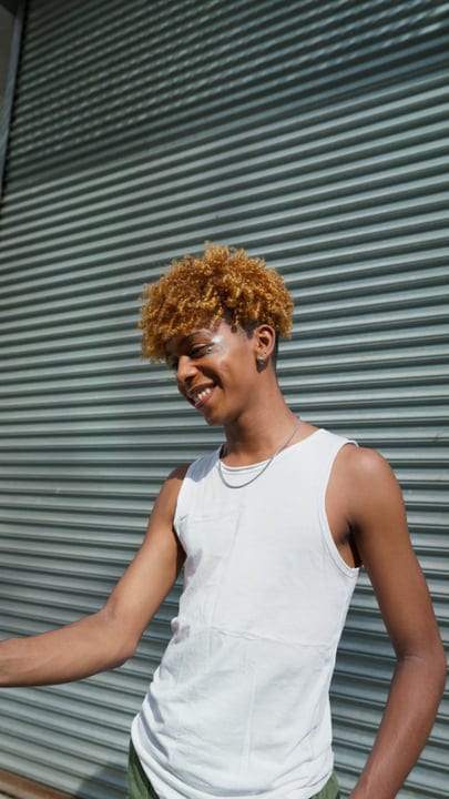 Laughter Echoes Against NYC's Steel Roll-Up Door