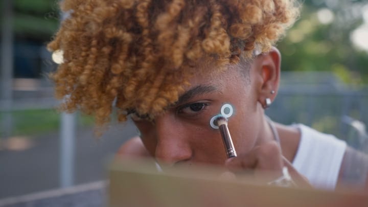 Young Artist Applying Makeup On A Sunny NYC Day
