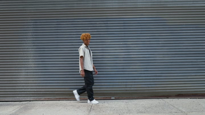 A Youthful Stroll Against Urban Steel In NYC