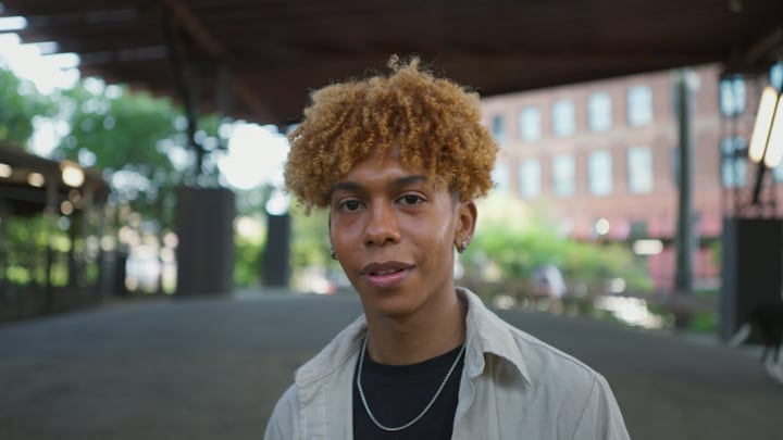 Young Man Embraces Urban Life Under City Bridges