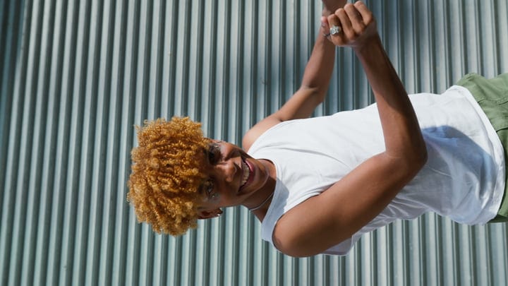 Joyful Youthful Energy Against Urban Steel Backdrop