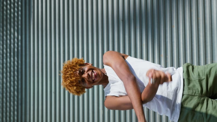 Laughter And Movement Against An Urban Backdrop