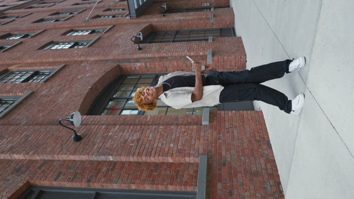 Youthful Energy Against Classic Red Brick Backdrop