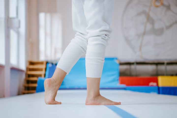 Graceful Balance: Woman Practicing Parkour Indoors