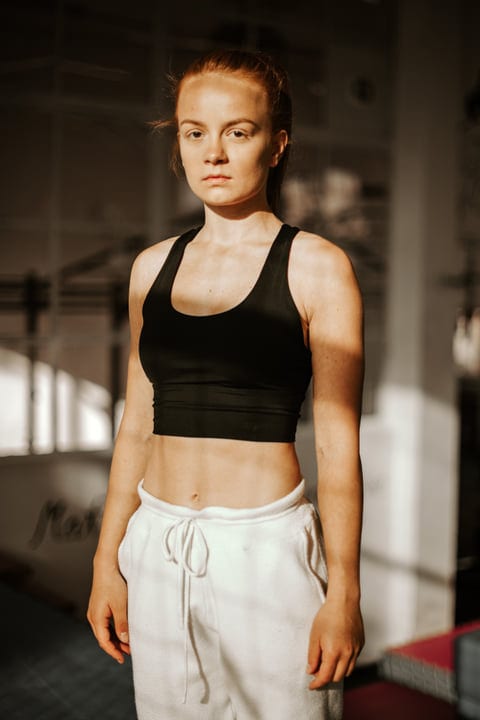 Confident Woman Embraces Parkour Challenge Indoors