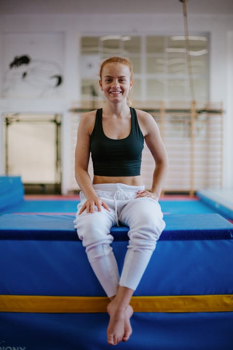 Young Woman Smiling After Intense Parkour Training Session