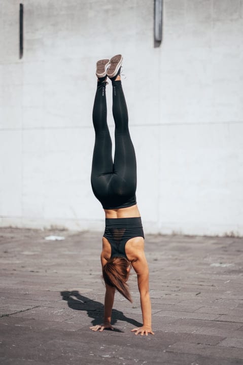 Defying Gravity: Woman Mastering Urban Handstand