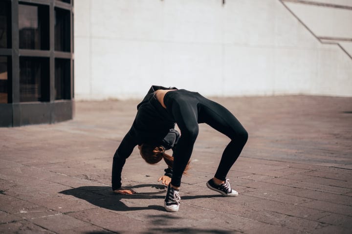 Fearless Movement: Woman Mastering Parkour In Urban Setting