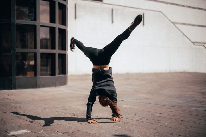 Dynamic Handstand In Urban Setting Captures Energy And Grace