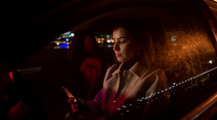 A Businesswoman Navigates the Night Streets In Style