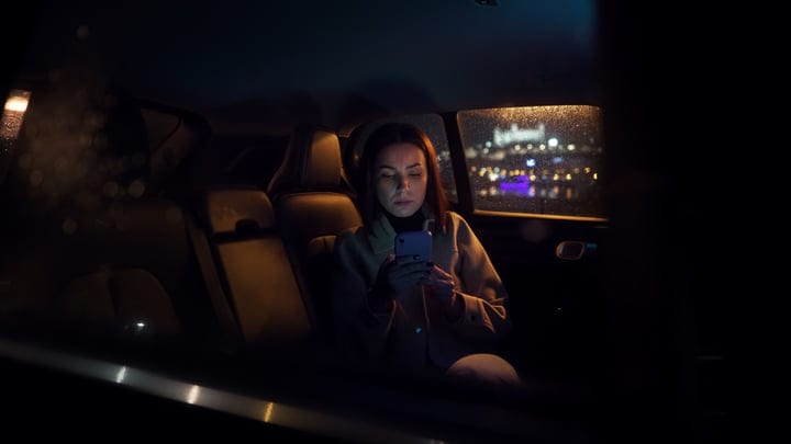 A Businesswoman Reflects During Her Nighttime Journey