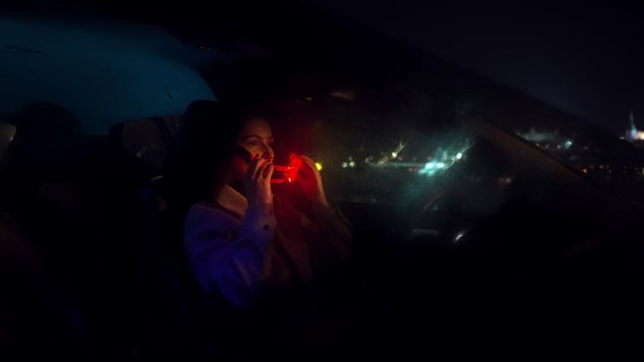 A Businesswoman Navigates the Night With Determination