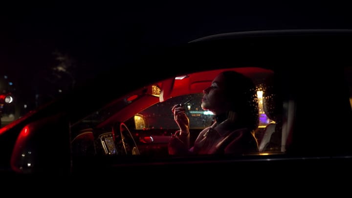Businesswoman Prepares For Night Drive With Confidence