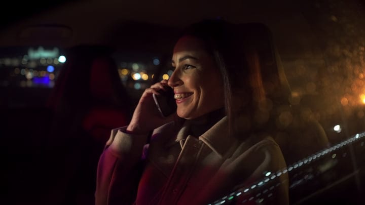 A Businesswoman Connects Under The City Lights