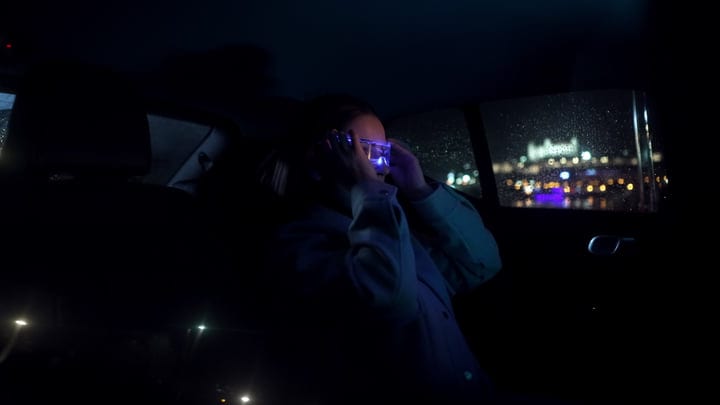 Businesswoman Navigates Night Cityscape With Confidence and Style