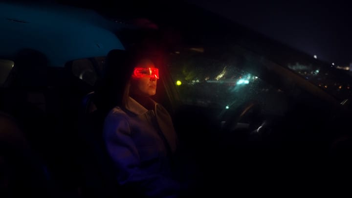 Night Drive Through Neon Lights With Focused Businesswoman