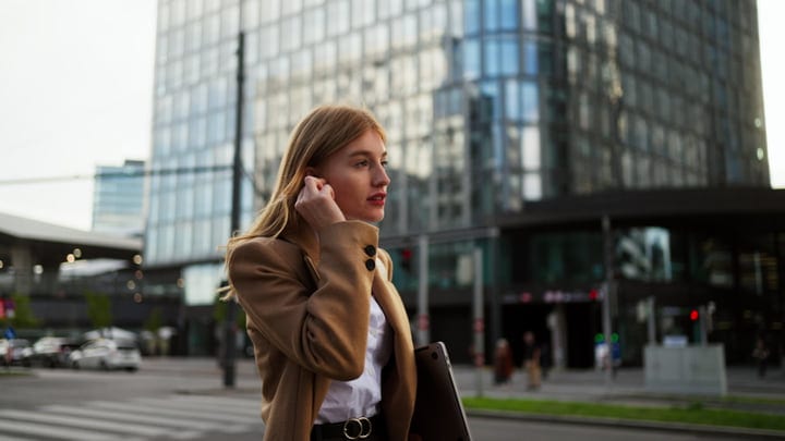 Confident Businesswoman Navigates Vienna's Urban Streetscape