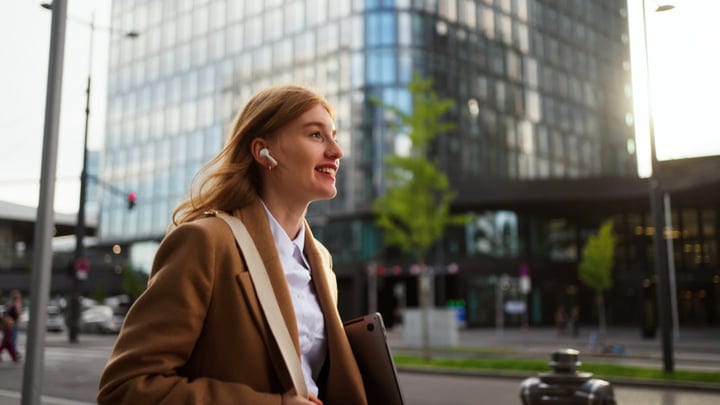 Smiling Businesswoman Walks Through Vienna's Urban Landscape