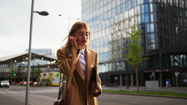 Confident Businesswoman Navigates Vienna's Urban Streets