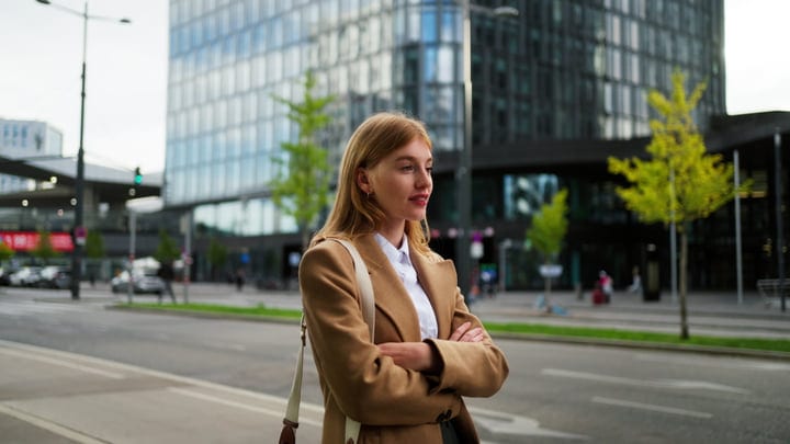 Young Businesswoman Standing On A Vienna Street With Arms Crossed