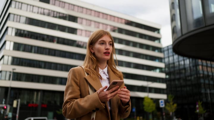 Confident Businesswoman Navigates Urban Vienna Streets