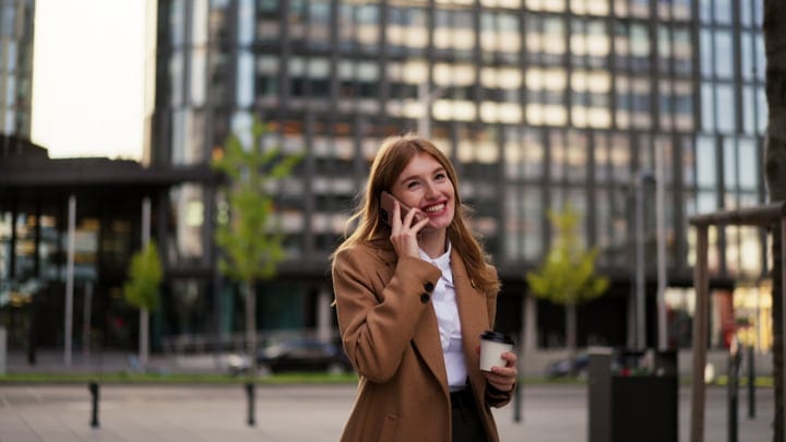 Confident Businesswoman Chats On Phone In Vienna Street