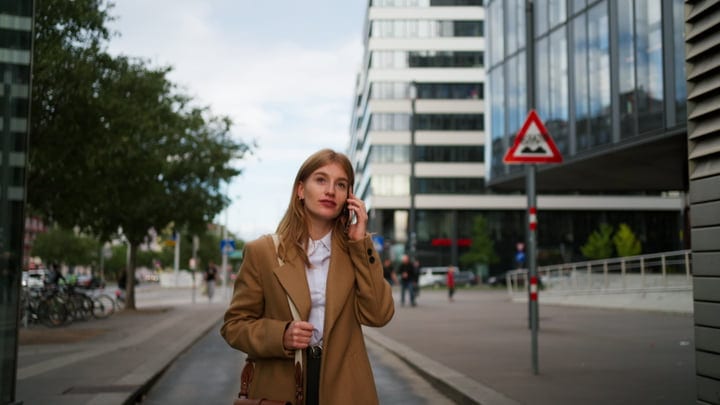Businesswoman Navigates Vienna Streets on an Autumn Morning