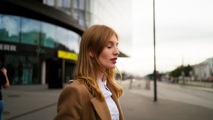 Businesswoman Embraces the Morning in Vienna's Urban Pulse