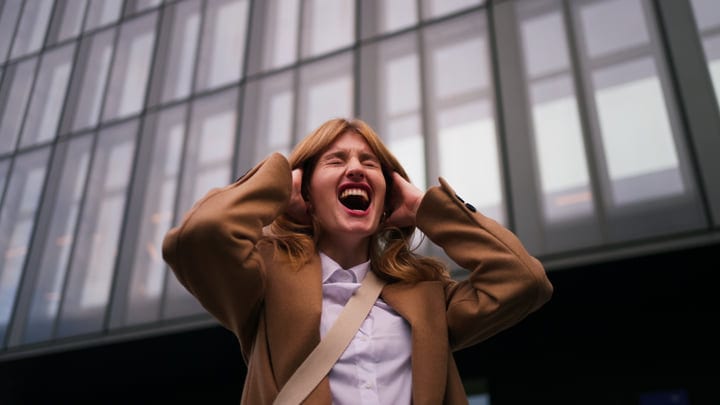 Joyful Expression Of A Businesswoman In Vienna's Urban Landscape