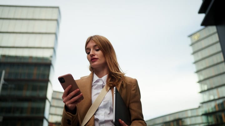 Businesswoman Navigates Urban Life In Vienna's Modern Streets