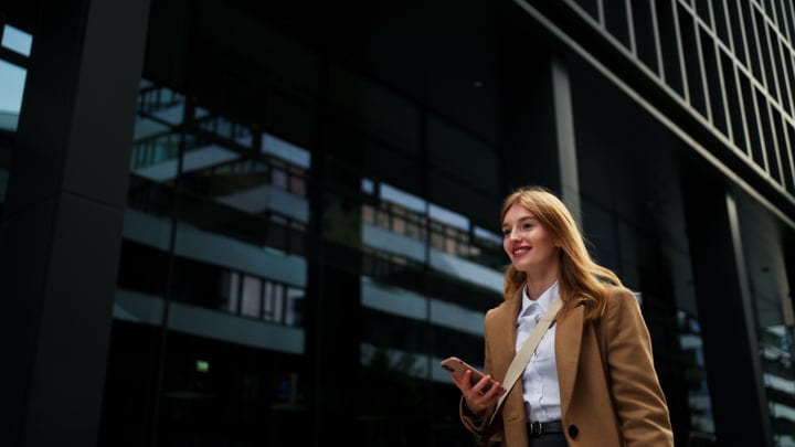 Confident Businesswoman Strolling Through Vienna's Urban Landscape
